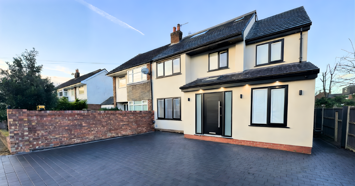 Completed house renovation with block-paved driveway