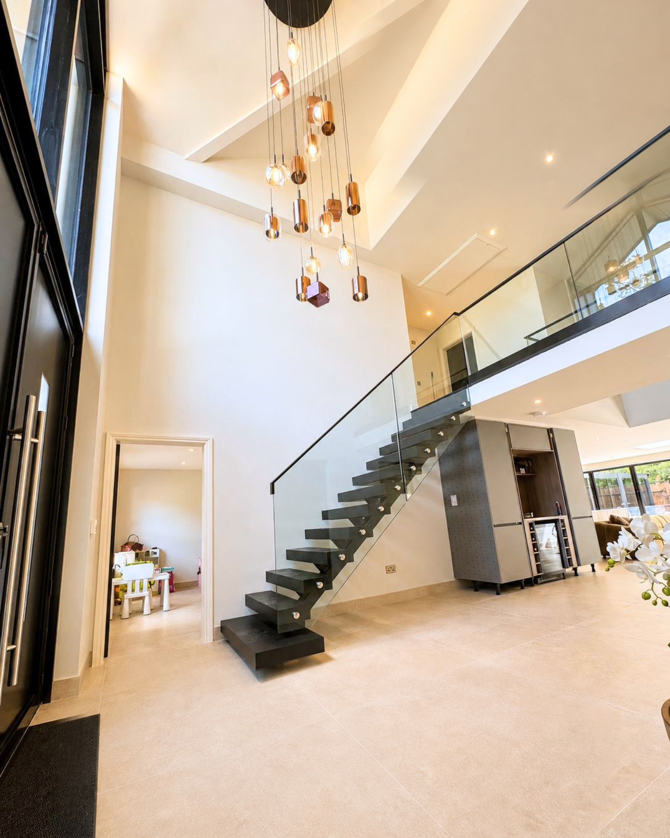 Modern floating staircase with glass balustrade